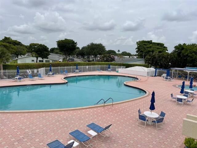 view of pool featuring a patio area