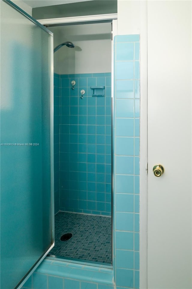 bedroom featuring a closet, ceiling fan, and light tile patterned floors