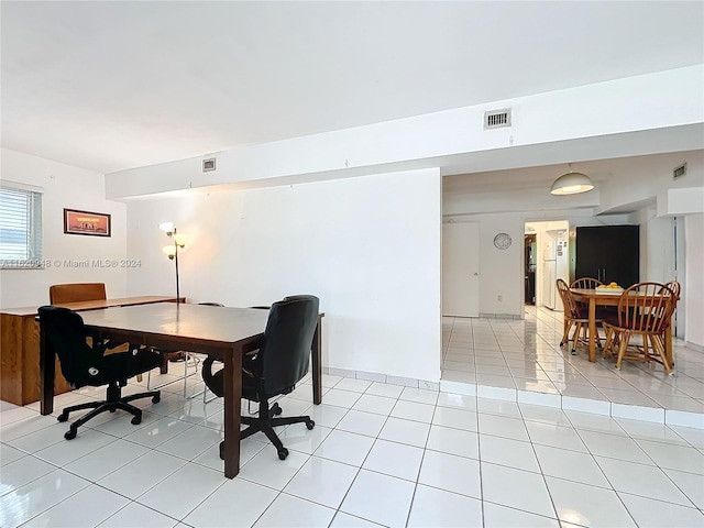 dining space with light tile patterned floors