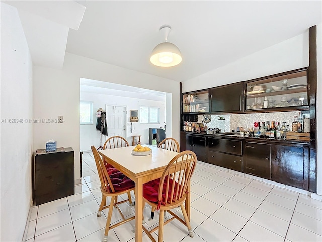 dining area with light tile patterned floors