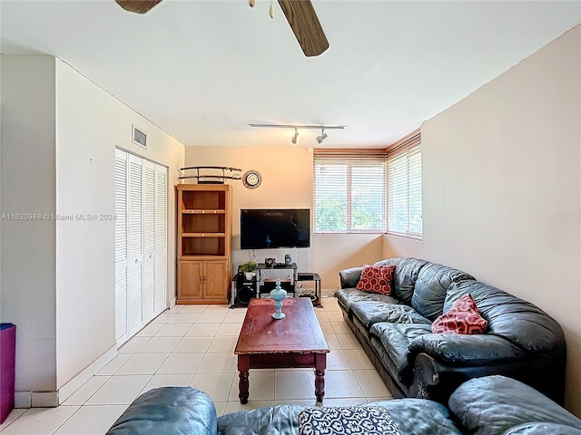 living room with ceiling fan, light tile patterned floors, and track lighting