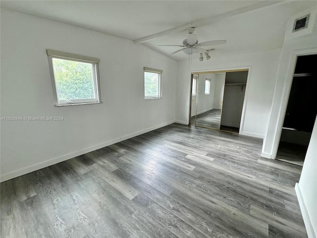 unfurnished bedroom featuring hardwood / wood-style floors, vaulted ceiling with beams, and ceiling fan