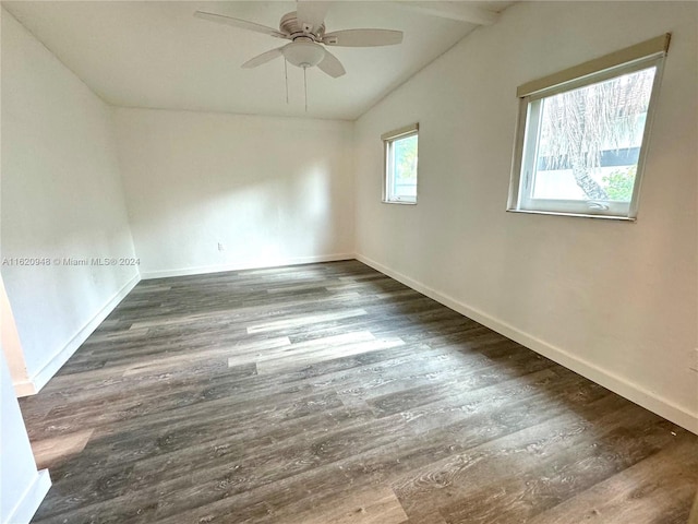 unfurnished room featuring lofted ceiling, dark hardwood / wood-style floors, and ceiling fan