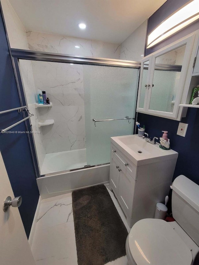 full bathroom with vanity, combined bath / shower with glass door, and toilet