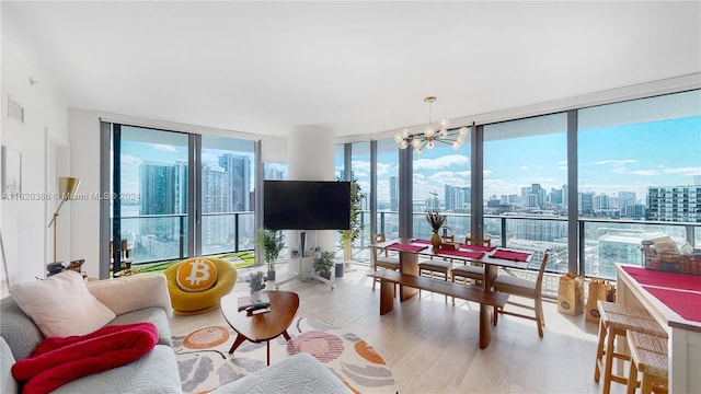 living room featuring light hardwood / wood-style floors and floor to ceiling windows