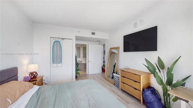 bedroom with light hardwood / wood-style floors