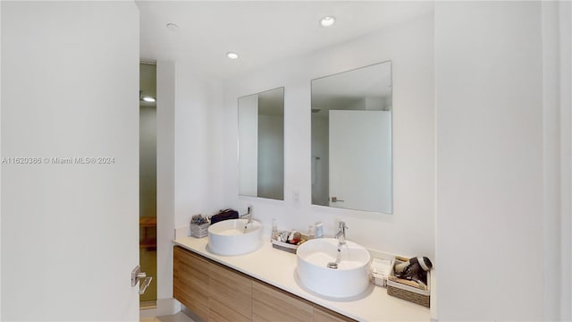 bathroom with dual bowl vanity