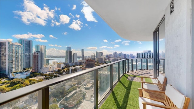 balcony featuring a water view