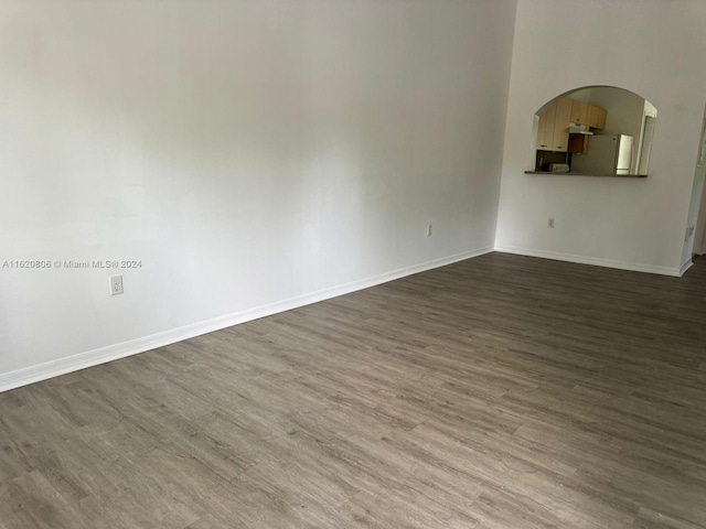 spare room featuring wood-type flooring