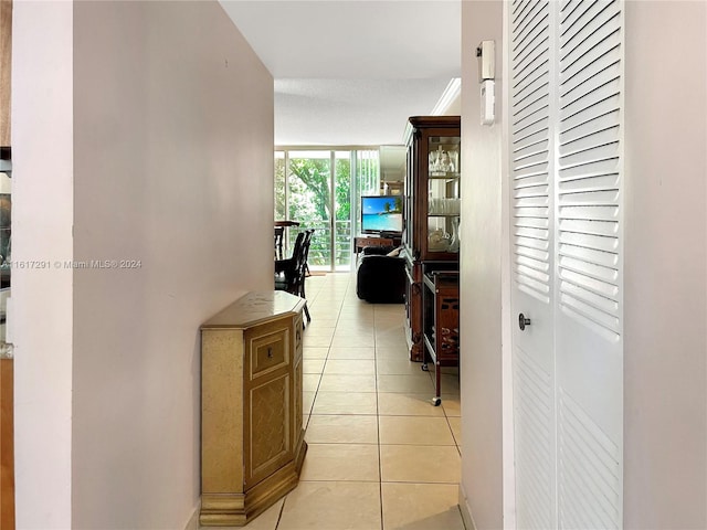 hallway featuring light tile patterned floors