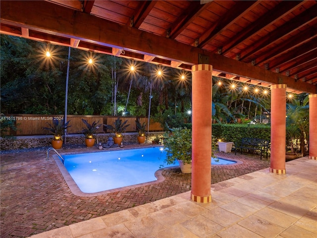 view of swimming pool featuring a patio area