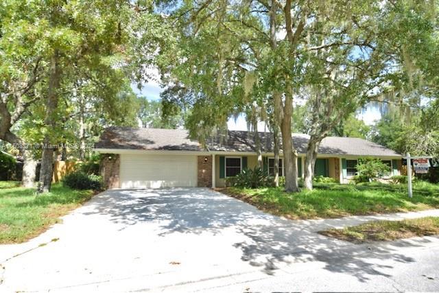 ranch-style house featuring a garage