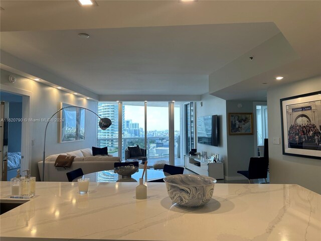 dining area featuring floor to ceiling windows