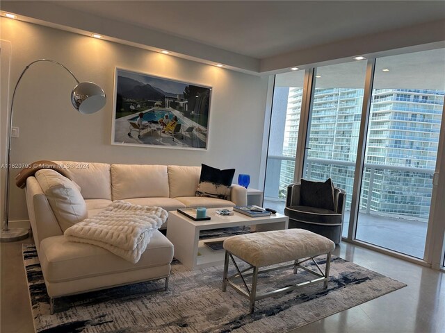 living room with floor to ceiling windows