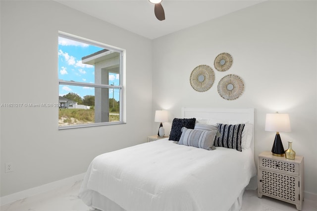 bedroom featuring ceiling fan and multiple windows