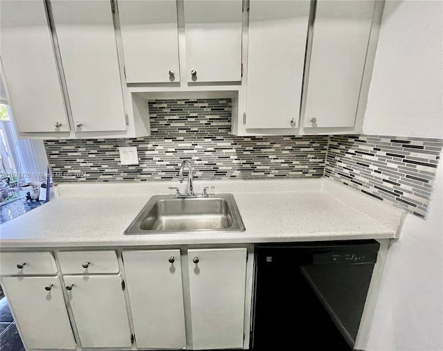 kitchen with dishwasher, white cabinets, tasteful backsplash, and sink