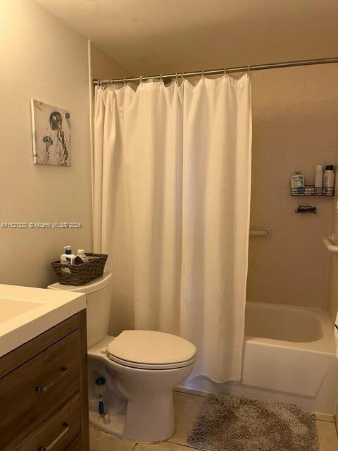 full bathroom featuring tile patterned flooring, shower / bathtub combination with curtain, toilet, and vanity