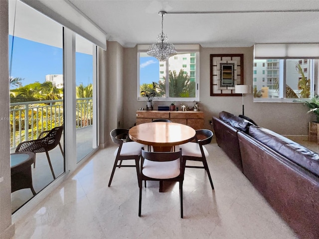 dining space featuring a chandelier, tile patterned flooring, and a textured ceiling