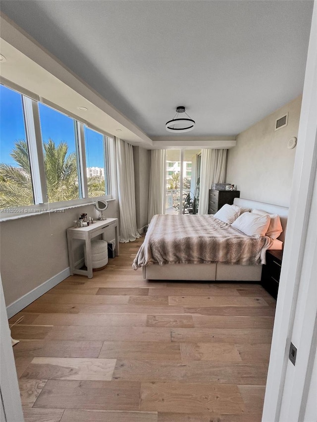 bedroom with light hardwood / wood-style flooring