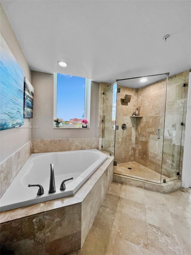 bathroom featuring tile patterned floors and plus walk in shower