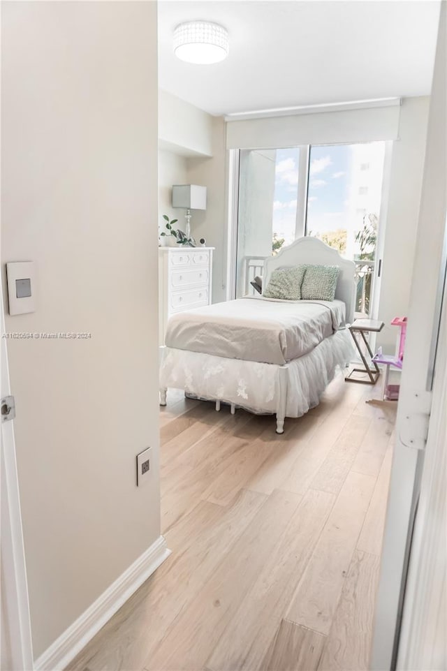 bedroom featuring light wood-type flooring