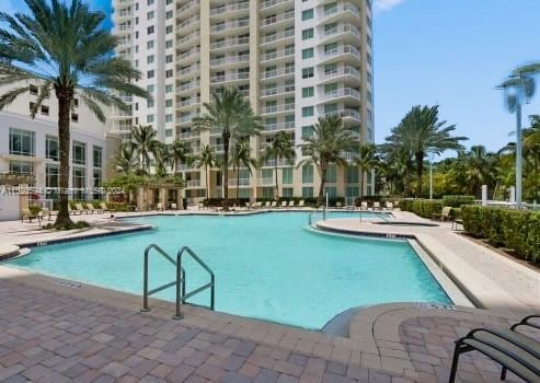 view of swimming pool featuring a patio area