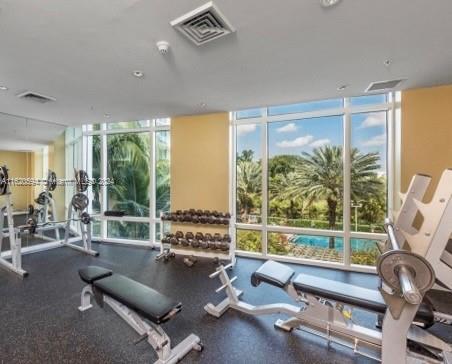 1745 E Hallandale Beach Blvd Unit 303W, Hallandale Beach, FL 33009 - gym with a wall of windows and plenty of natural light