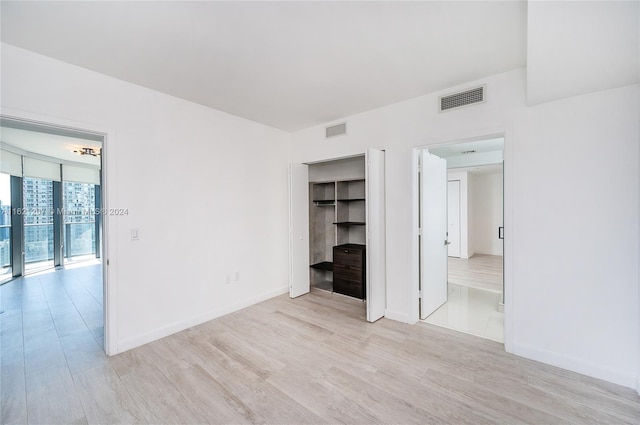 unfurnished room featuring light wood-type flooring