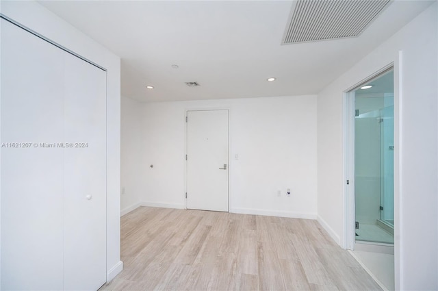 unfurnished room featuring light wood-type flooring