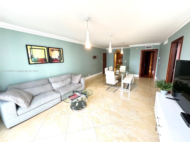 living room featuring light tile patterned floors and crown molding