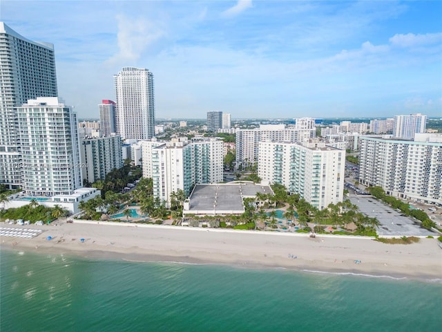 aerial view featuring a water view and a beach view