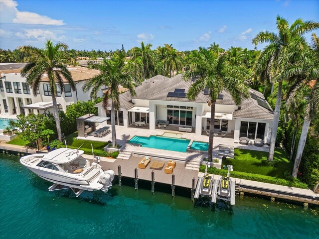 exterior space featuring a boat dock and a water view