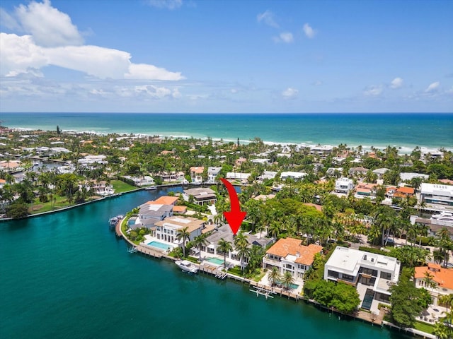 birds eye view of property featuring a water view and a residential view