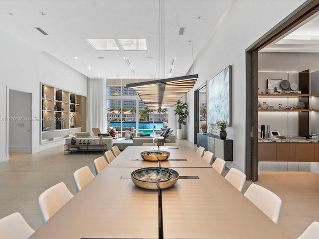 dining room with a skylight