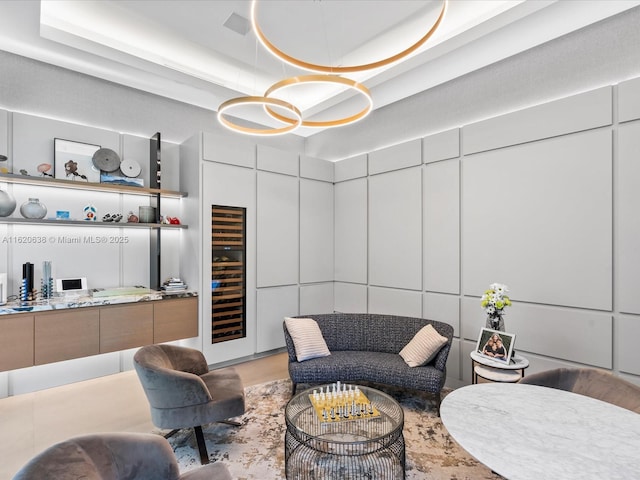 interior space with wine cooler and a raised ceiling