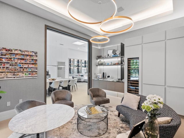 dining space with a raised ceiling