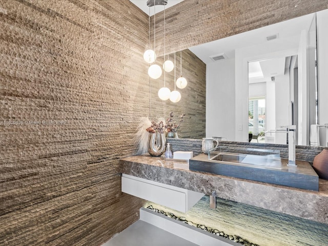 bathroom with visible vents and vanity