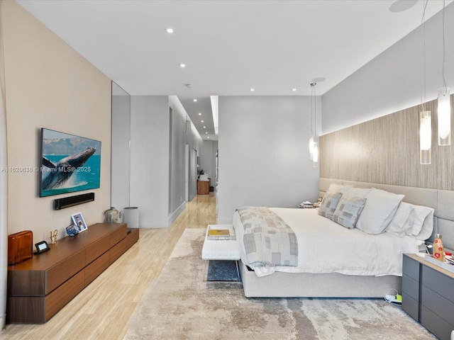 bedroom with light wood-type flooring and recessed lighting