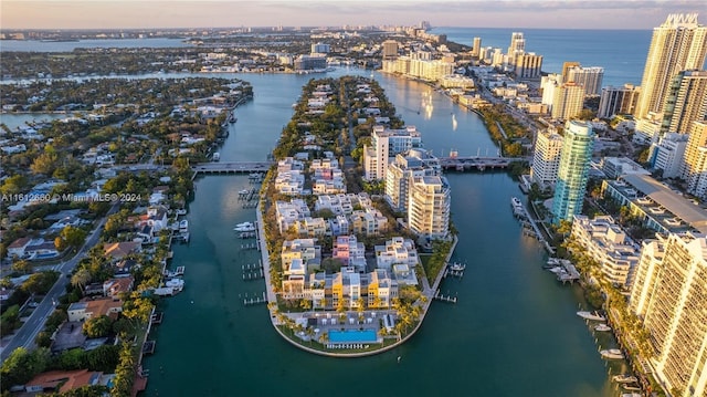 aerial view at dusk with a water view