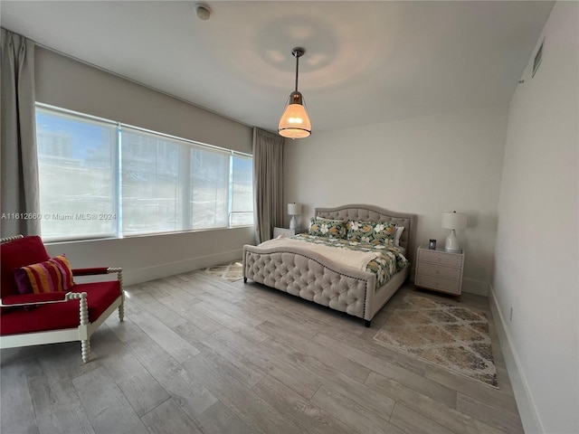 bedroom with light wood-type flooring