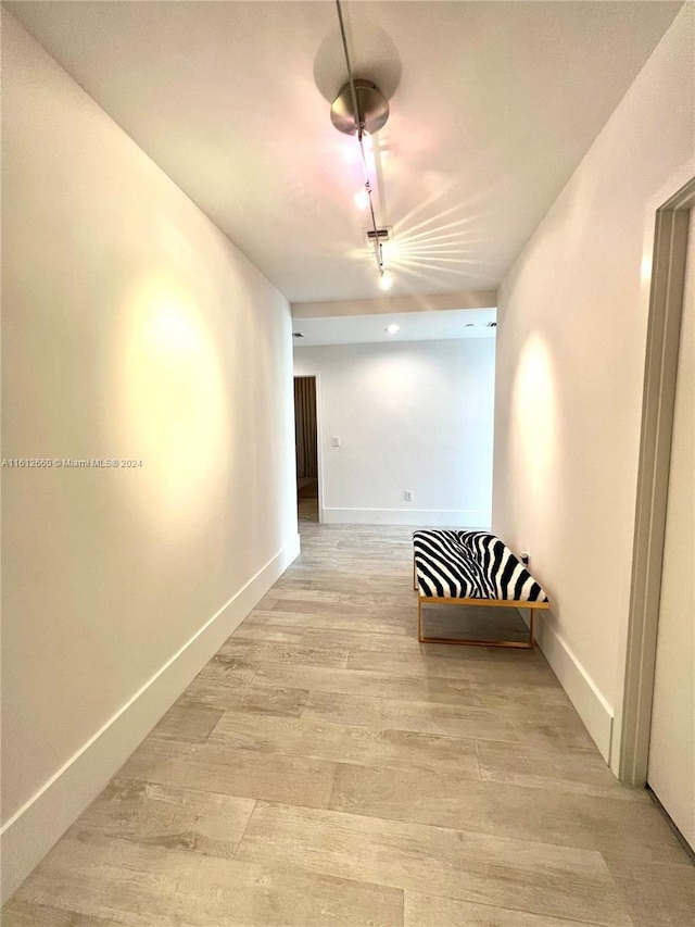 corridor featuring light hardwood / wood-style flooring