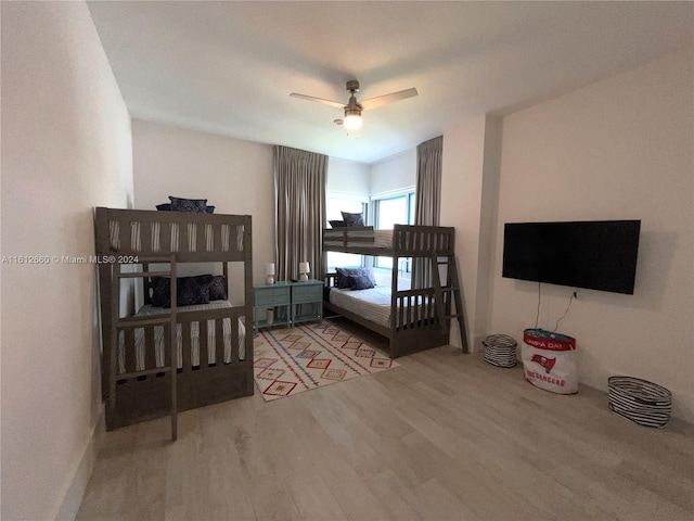 bedroom featuring ceiling fan and hardwood / wood-style flooring