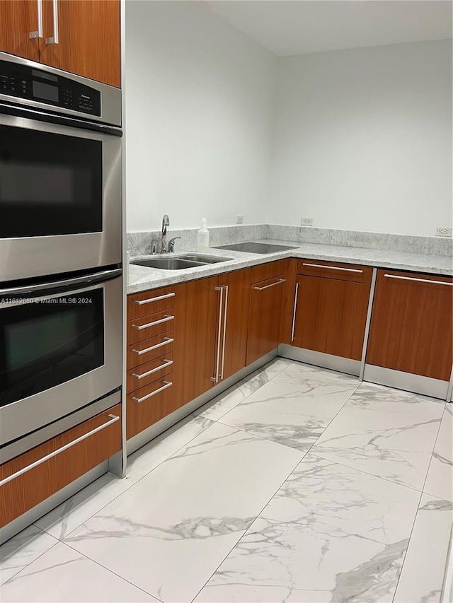 kitchen with double oven and sink