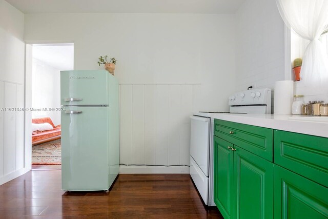 kitchen featuring dark hardwood / wood-style flooring and white appliances