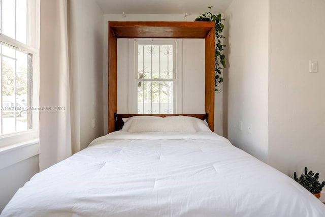 bedroom featuring multiple windows
