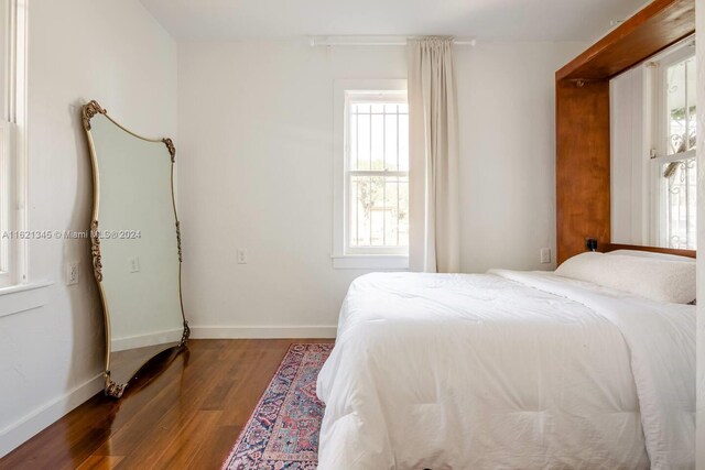 bedroom with wood-type flooring