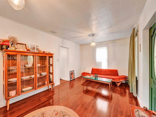 living area with hardwood / wood-style flooring