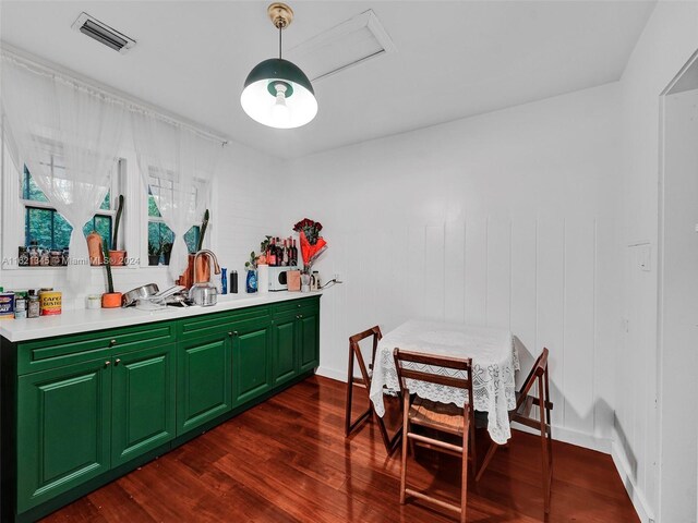 dining space with dark hardwood / wood-style flooring