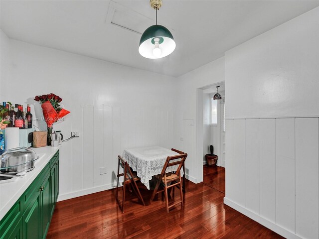 dining space with hardwood / wood-style floors