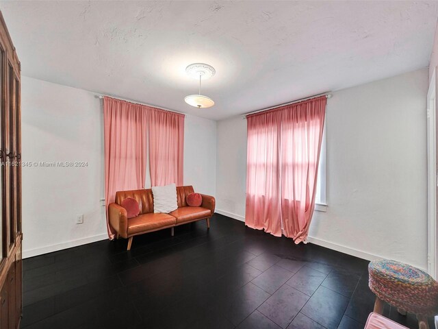 sitting room with tile patterned floors